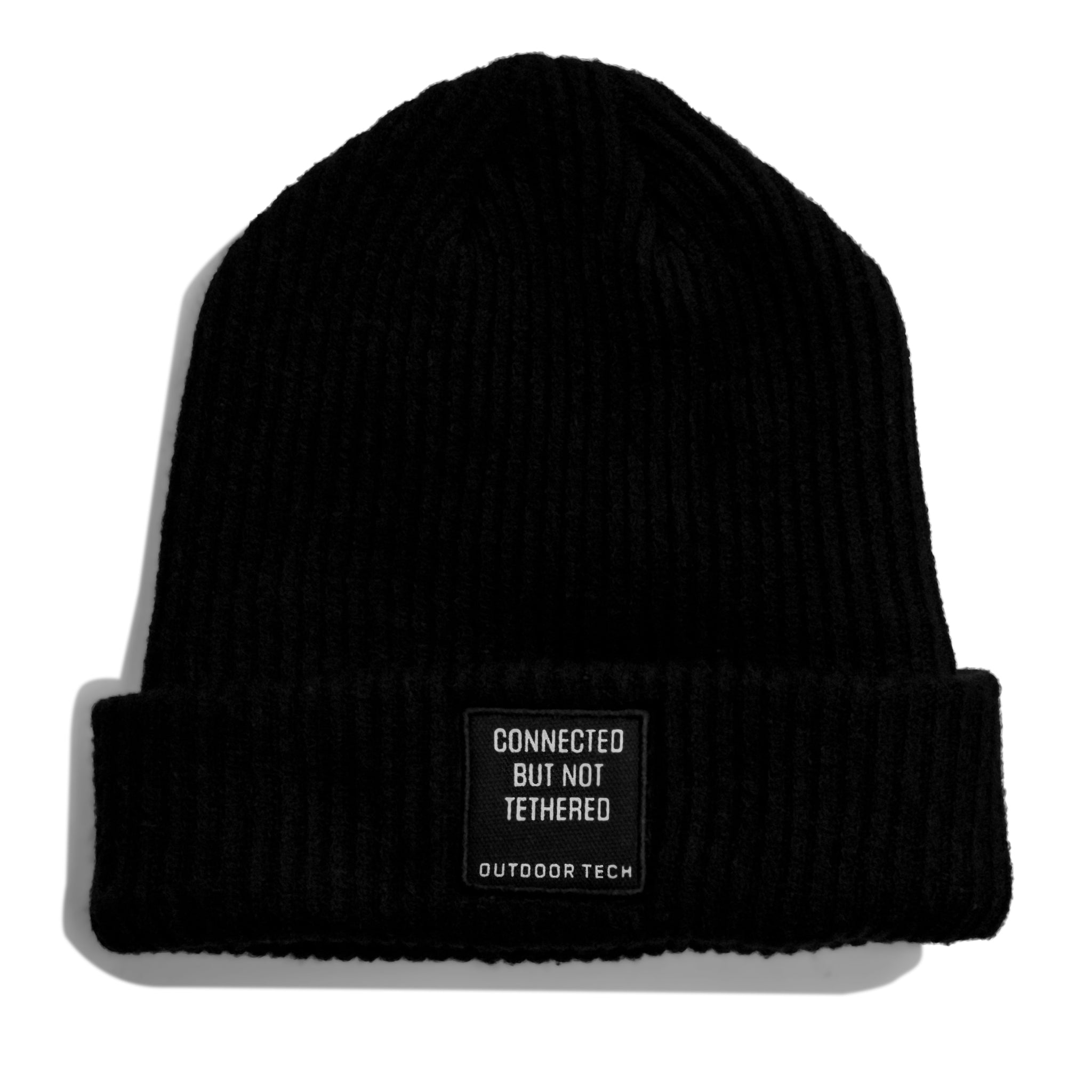 Side view of Shred Beanie with a patch that says "Connected but not Tethered"